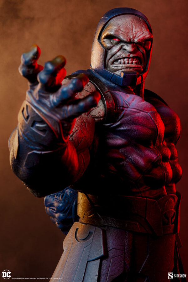 Darkseid DC Comics Maquette from Sideshow Collectibles. A close-up of a Darkseid figurine with an aggressive stance, intricately detailed textures, and vibrant colors highlighted under dramatic lighting.