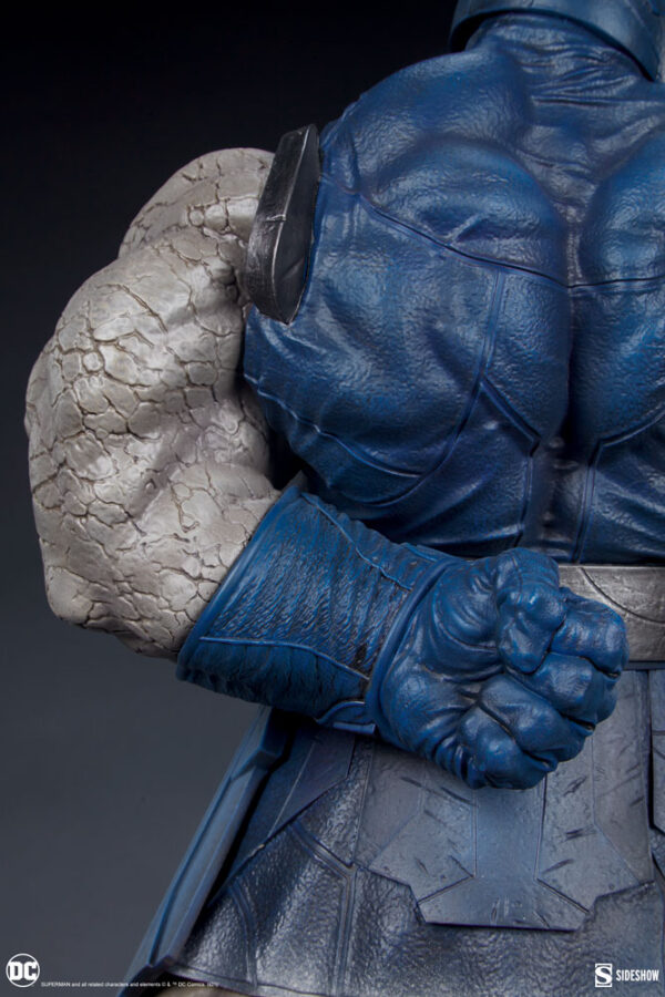 Darkseid DC Comics Maquette from Sideshow Collectibles. A detailed image showing the upper body and clenched fist of a Darkseid collectible statue with intricate textures on the costume and skin.