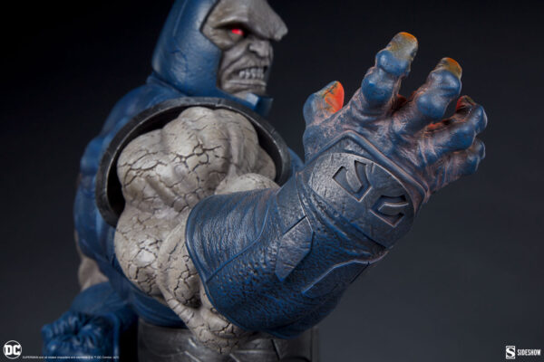 Darkseid DC Comics Maquette from Sideshow Collectibles. Close-up image of a detailed Darkseid statue showcasing its textured skin, armored suit, and glowing red eyes.