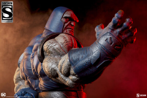 Darkseid DC Comics Maquette from Sideshow Collectibles. A detailed collectible statue of Darkseid from DC Comics with a focus on his hand and face against a smoky red background.