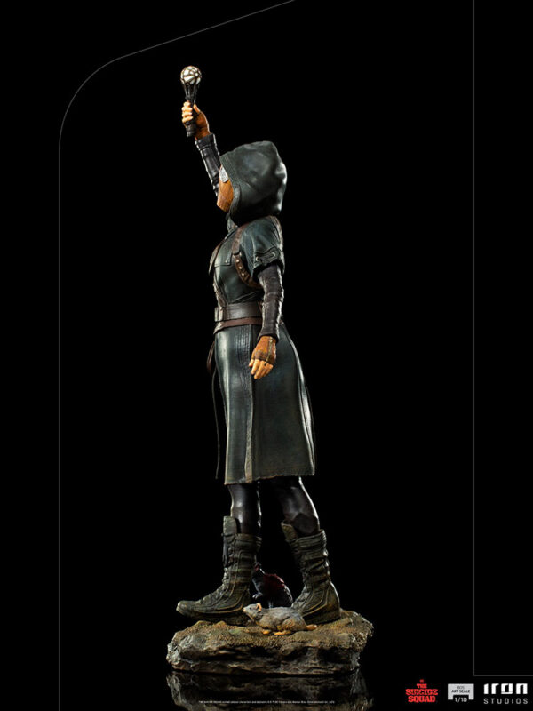 Ratcatcher II BDS Art Scale 1:10 Statue from DC Comics and Iron Studios. A collectible figure in a long coat and hood raising a staff, standing on a rocky base with a squirrel at the feet, on a black background.