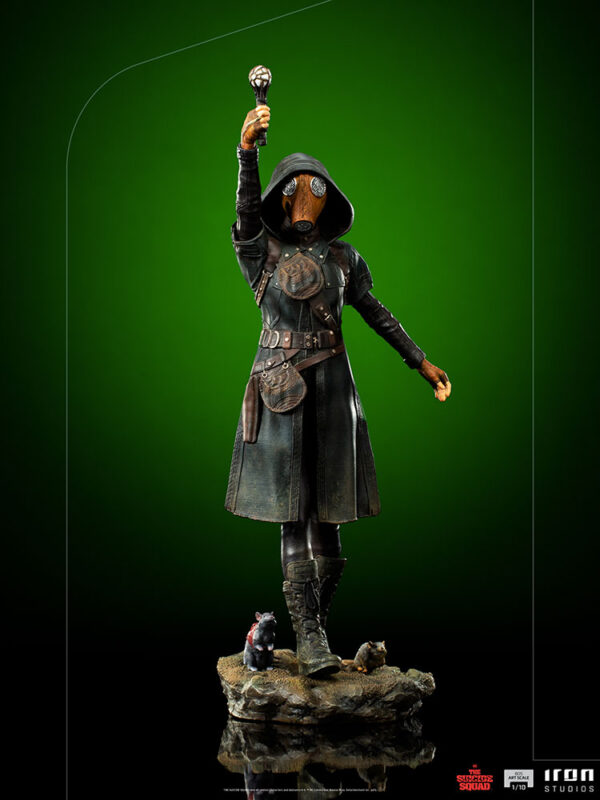 Ratcatcher II BDS Art Scale 1:10 Statue from DC Comics and Iron Studios. A collectible figurine of a plague doctor with a raised staff, standing on a base with two miniature rats, against a green background.