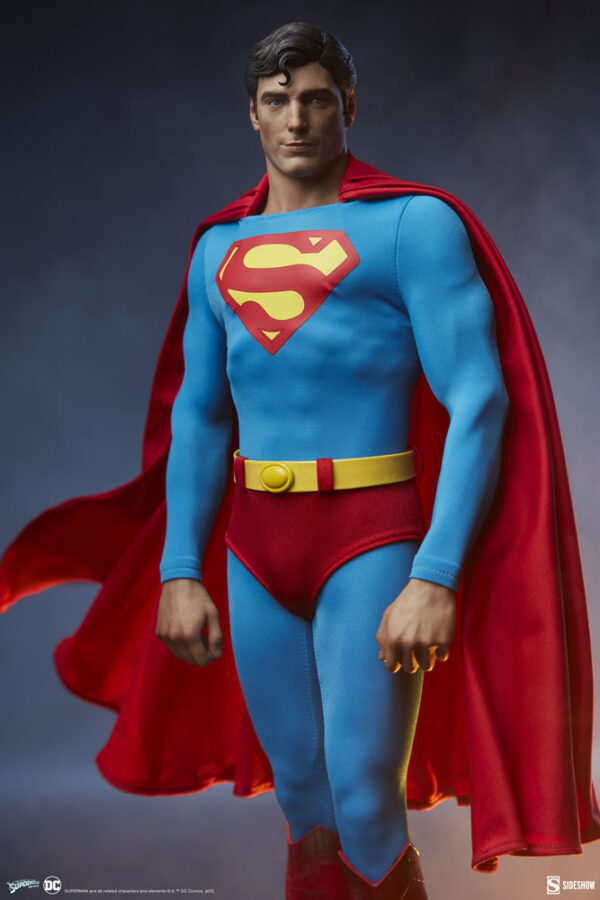 Superman: The Movie Premium Format™ Figure from Sideshow Collectibles and DC Comics. A detailed collectible figure of Superman, wearing his traditional blue suit with red cape, against a gradient background.