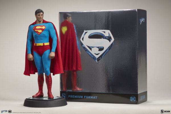 Superman: The Movie Premium Format™ Figure from Sideshow Collectibles and DC Comics. A Superman statue in classic costume standing next to its premium format box with the Superman logo.