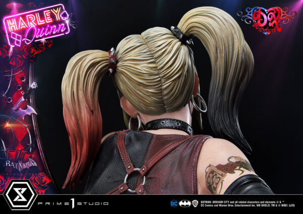 Harley Quinn Deluxe Batman Arkham City Statue Deluxe Version 1:3 Scale Statue from DC Comics and Prime 1 Studio. A close-up image of a Harley Quinn figure from the back showcasing her distinctive pigtail hairstyle and themed tattoo on her upper right arm.