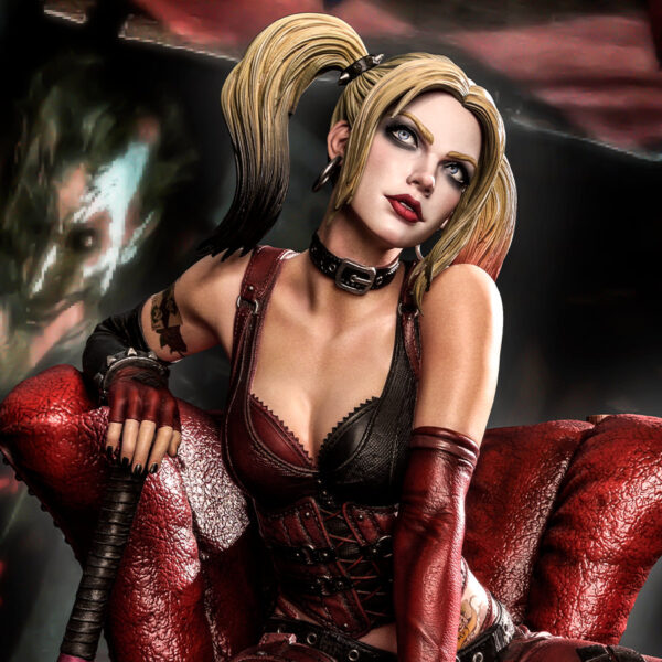 Harley Quinn Deluxe Batman Arkham City Statue Deluxe Version 1:3 Scale Statue from DC Comics and Prime 1 Studio. Image of a stylized female character with blonde pigtails, wearing a gothic costume and sitting on a red throne-like chair, holding a weapon, with a blurry figure in the background.