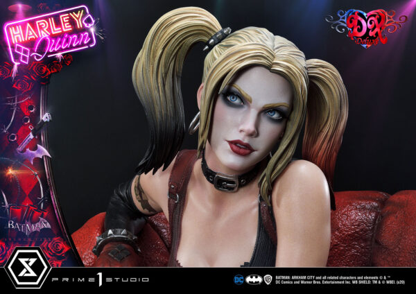 Harley Quinn Deluxe Batman Arkham City Statue Deluxe Version 1:3 Scale Statue from DC Comics and Prime 1 Studio. Image of a highly detailed collectible figure based on the character Harley Quinn, featuring her distinctive black and red costume elements, sitting against a dark background with neon-style logo.