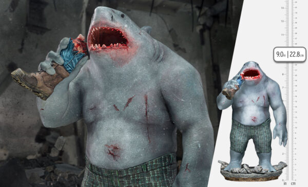 King Shark 1:10 Scale Statue from Iron Studios and DC Comics. Digital artwork of a creature with a shark's head, humanoid body, and miniature version of itself, with a size reference scale.