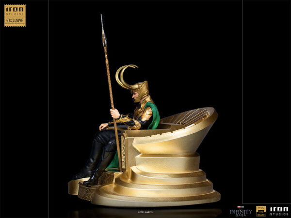 Loki 1:10 Scale Statue by Marvel and Iron Studios. A collectible figure of a character in elaborate armor sitting on a golden throne, holding a spear, from Iron Studios' exclusive series.