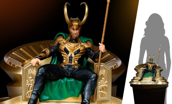 Loki 1:10 Scale Statue by Marvel and Iron Studios. A detailed figure of a character dressed in a green and gold costume seated on a golden throne, holding a staff, with a shadow silhouette to the right.