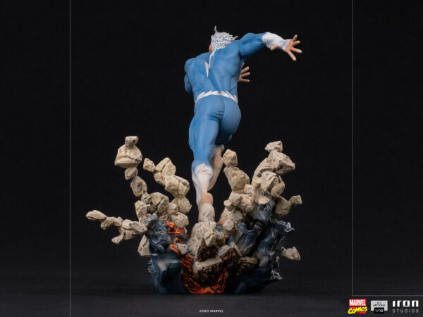 Marvel Quicksilver 1:10 scale statue from Iron Studios. An action figure of a superhero in a dynamic pose, with rock and flame effects as if taking off or landing, against a black background.