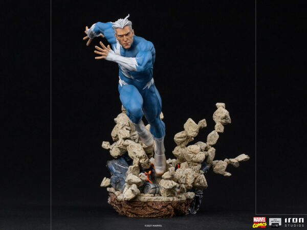 Marvel Quicksilver 1:10 scale statue from Iron Studios. A detailed figure of Quicksilver in a dynamic running pose, with debris suspended in motion around him on a black background.