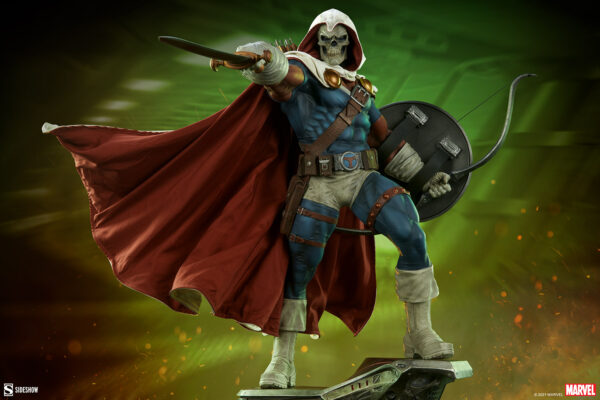 Marvel Taskmaster Premium Format Figure from Sideshow Collectibles. Illustration of a fictional character dressed as a warrior with a skull mask, red cape, and shield, set against a dynamic green and orange background.