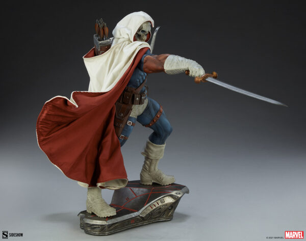 Marvel Taskmaster Premium Format Figure from Sideshow Collectibles. A highly detailed figure of a character from Assassin's Creed, standing with a sword on a themed base, wearing a white hooded cloak and a red cape.