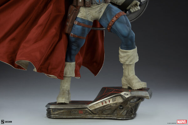 Marvel Taskmaster Premium Format Figure from Sideshow Collectibles. A detailed collectible statue of a superhero, featuring a red cape, armored costume, and standing on a futuristic hovering base.