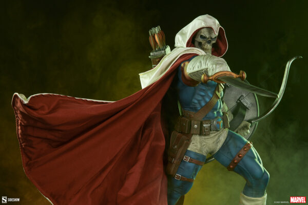 Marvel Taskmaster Premium Format Figure from Sideshow Collectibles. A figure of Taskmaster with a skull mask, hooded white cape, and bow and arrow, set against a green smoky background.