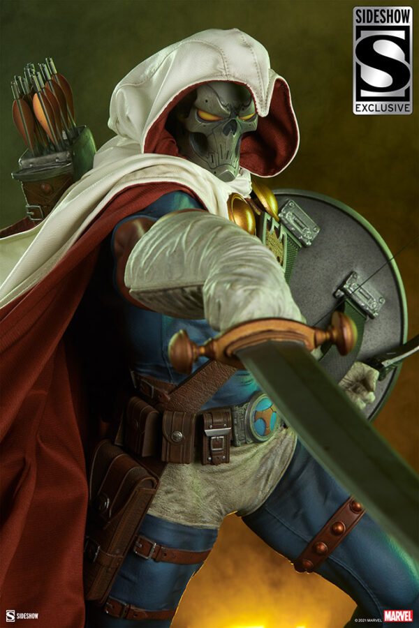 Marvel Taskmaster Premium Format Figure from Sideshow Collectibles. A close-up image of a collectible figure wearing a hooded cloak and mask, armed with a bow, quiver with arrows, and a shield, set against a yellow-hued background.