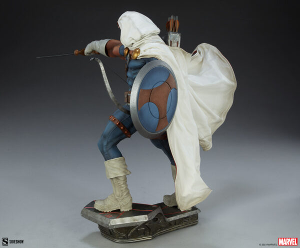 Marvel Taskmaster Premium Format Figure from Sideshow Collectibles. A detailed collectible statue of an archer in a hooded cloak, wielding a bow and shield, standing on a themed base.