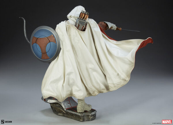 Marvel Taskmaster Premium Format Figure from Sideshow Collectibles. A cloaked figure with a hidden face, holding a shield and drawing a sword, with dynamic flowing cape and futuristic armored boots.