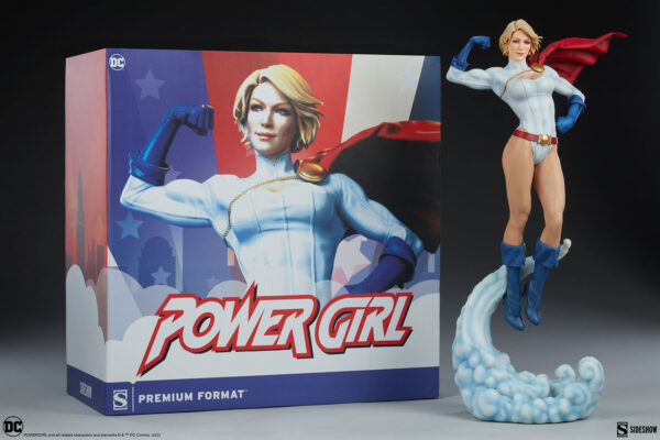 Power Girl Premium Format™ Figure from Sideshow Collectibles. Figure of Power Girl with cape flowing, displayed next to its original packaging with DC and Sideshow branding.