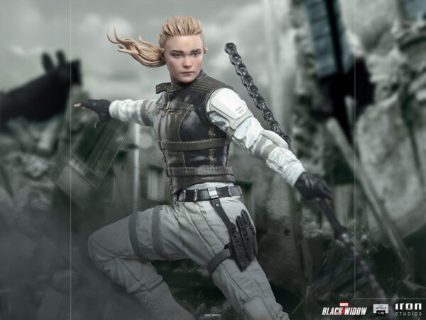 Yelena Belova 1:10 BDS Art Scale Statue from Marvel and Iron Studios. A female action figure with blonde hair, dressed in tactical combat attire, is positioned in a dynamic combat stance against a blurred background.