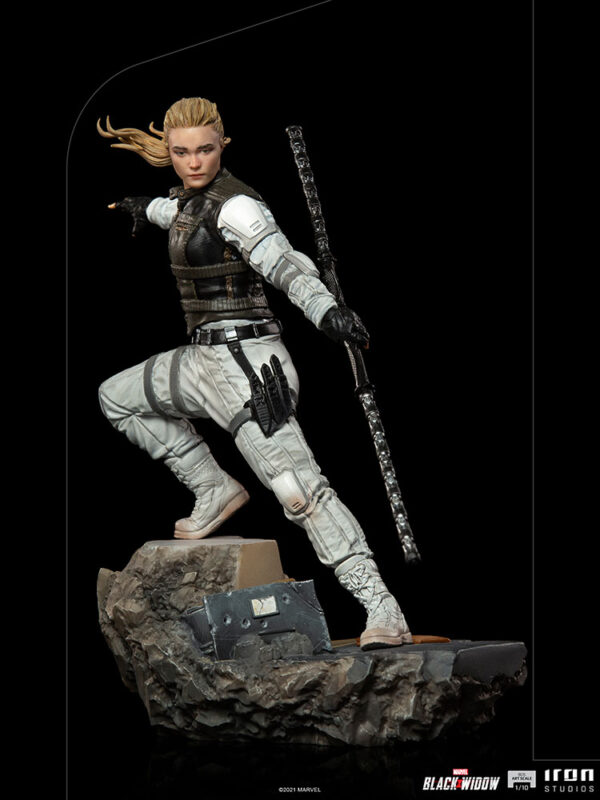 Yelena Belova 1:10 BDS Art Scale Statue from Marvel and Iron Studios. A highly detailed collectible figure of a female character in combat attire poised on a rocky base, brandishing a staff-like weapon, with dynamic hair and clothing suggesting movement.