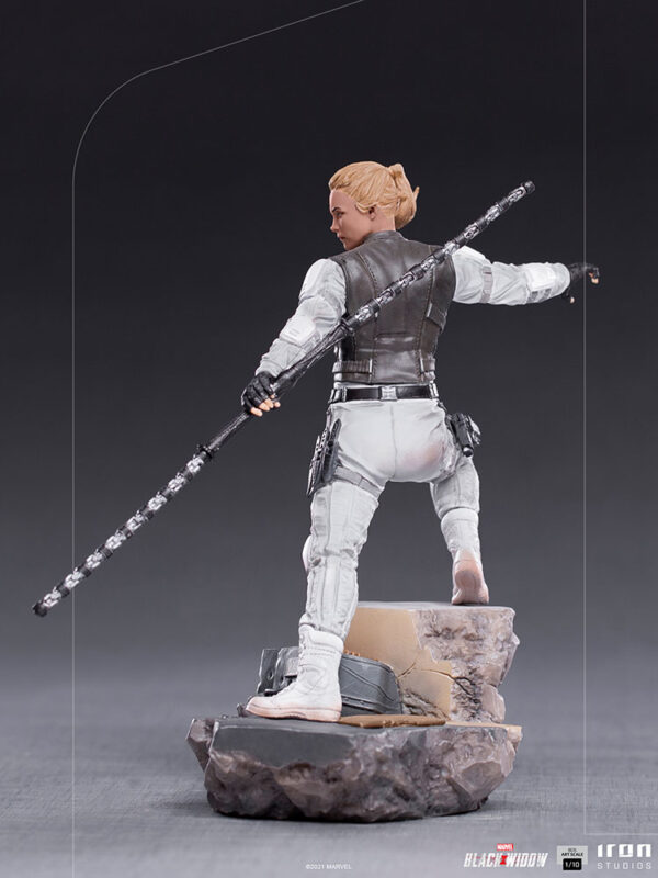 Yelena Belova 1:10 BDS Art Scale Statue from Marvel and Iron Studios. An action figure poised in combat stance with a staff, displayed on a rocky base.