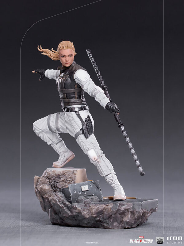 Yelena Belova 1:10 BDS Art Scale Statue from Marvel and Iron Studios. An action figure of a blonde character with a staff in a dynamic battle stance on a rocky base.