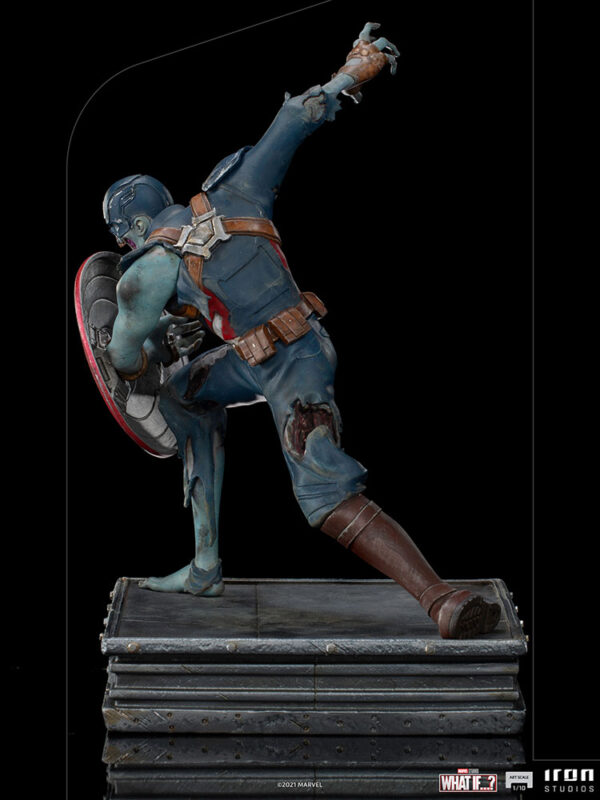 Zombie Captain America Art Scale 1:10 Statue. Zombie Captain America statue in a crouched pose, holding his iconic shield in a defensive stance. His skin appears decayed and blue-toned, with exposed muscles and torn uniform, embodying a grotesque and undead version of the classic Marvel superhero. The statue is set on a rugged, metallic base.