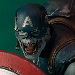 Zombie Captain America Art Scale 1:10 Statue. Zombie Captain America statue in a crouched pose, holding his iconic shield in a defensive stance. His skin appears decayed and blue-toned, with exposed muscles and torn uniform, embodying a grotesque and undead version of the classic Marvel superhero. The statue is set on a rugged, metallic base.