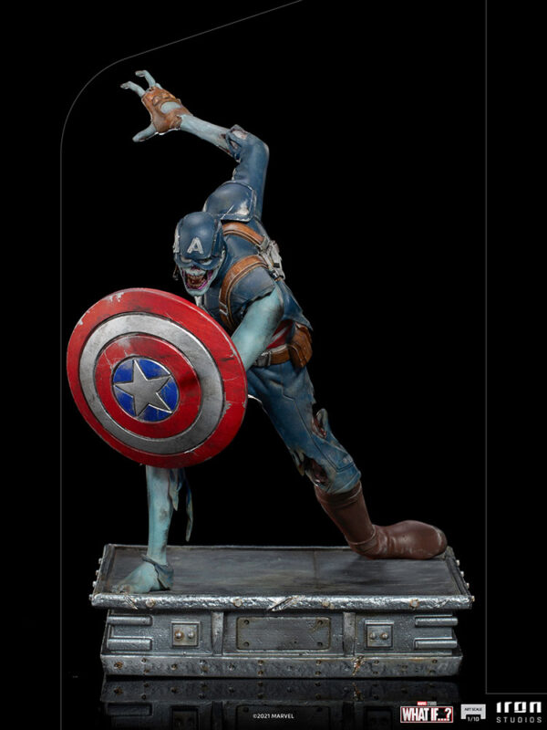 Zombie Captain America Art Scale 1:10 Statue. Zombie Captain America statue in a crouched pose, holding his iconic shield in a defensive stance. His skin appears decayed and blue-toned, with exposed muscles and torn uniform, embodying a grotesque and undead version of the classic Marvel superhero. The statue is set on a rugged, metallic base.