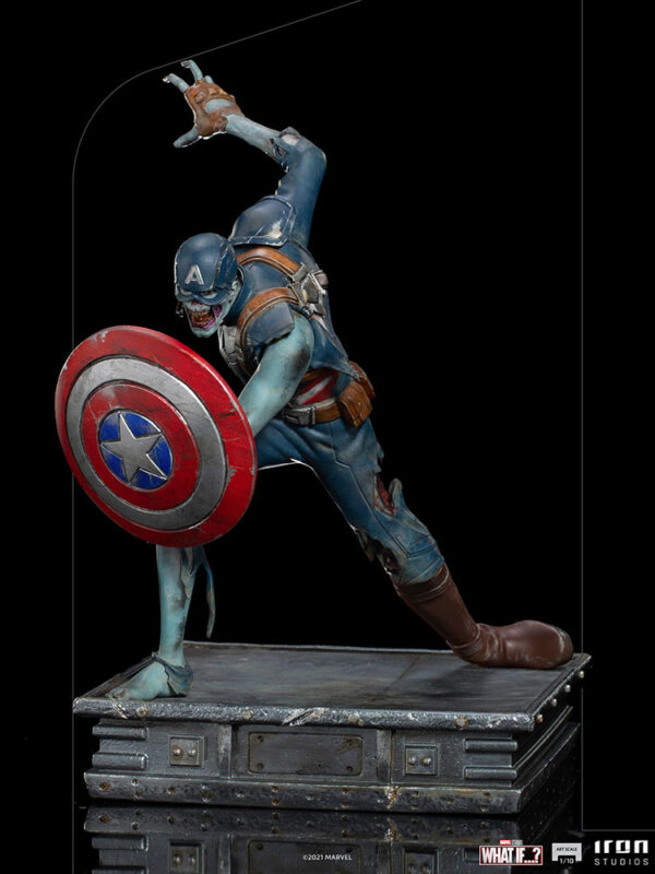 Zombie Captain America Art Scale 1:10 Statue. Zombie Captain America statue in a crouched pose, holding his iconic shield in a defensive stance. His skin appears decayed and blue-toned, with exposed muscles and torn uniform, embodying a grotesque and undead version of the classic Marvel superhero. The statue is set on a rugged, metallic base.