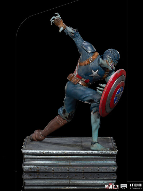 Zombie Captain America Art Scale 1:10 Statue. Zombie Captain America statue in a crouched pose, holding his iconic shield in a defensive stance. His skin appears decayed and blue-toned, with exposed muscles and torn uniform, embodying a grotesque and undead version of the classic Marvel superhero. The statue is set on a rugged, metallic base.