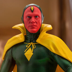 Vision Halloween Version WandaVision Art Scale 1:10 Statue from Marvel and Iron Studios. Close-up of a superhero action figure with green and yellow costume and a serious expression.