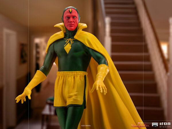 Vision Halloween Version WandaVision Art Scale 1:10 Statue from Marvel and Iron Studios. A figure in a classic superhero costume with a yellow cape posing in a home interior setting