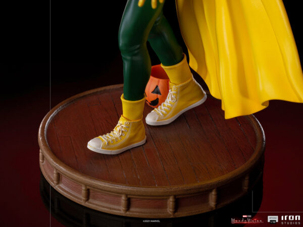 Vision Halloween Version WandaVision Art Scale 1:10 Statue from Marvel and Iron Studios. Close-up view of a collectible superhero figure's feet with yellow sneakers, standing on a wooden base