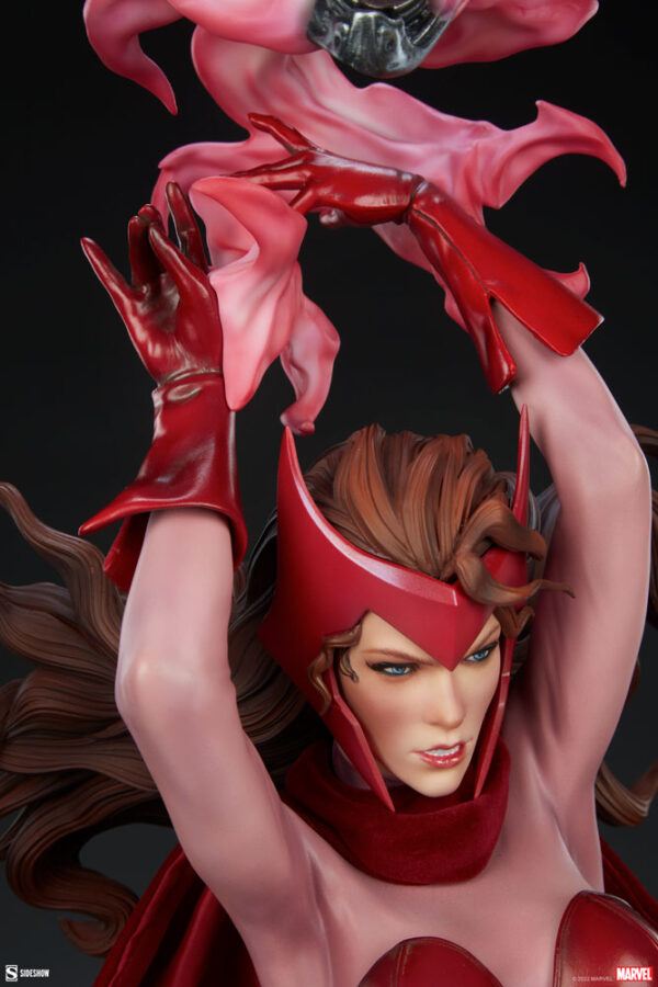 Marvel Scarlet Witch Premium Format™ Figure from Sideshow Collectibles, 2021. Close-up of a collectible statue depicting a female superhero in a red outfit with flowing cape and dramatic hand gestures.