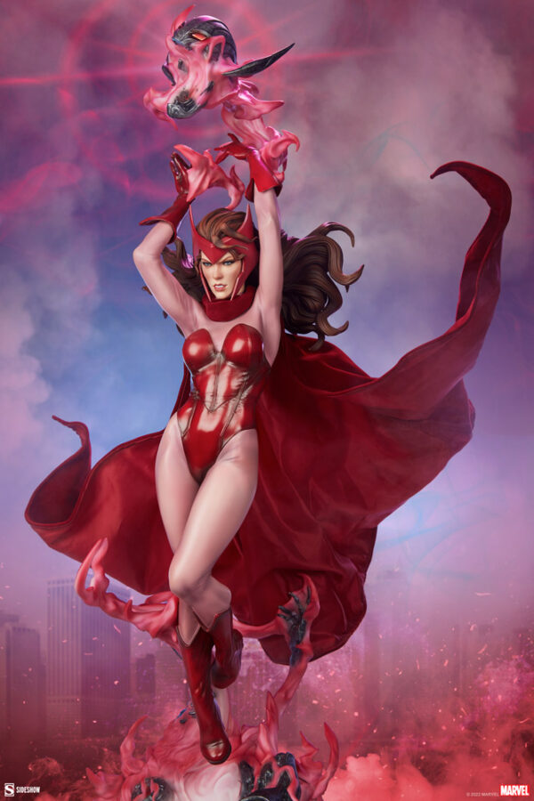 Marvel Scarlet Witch Premium Format™ Figure from Sideshow Collectibles, 2021. Artistic depiction of a fictional character in a red costume with a flowing cape, surrounded by magical energy and a summoned creature against a misty backdrop.